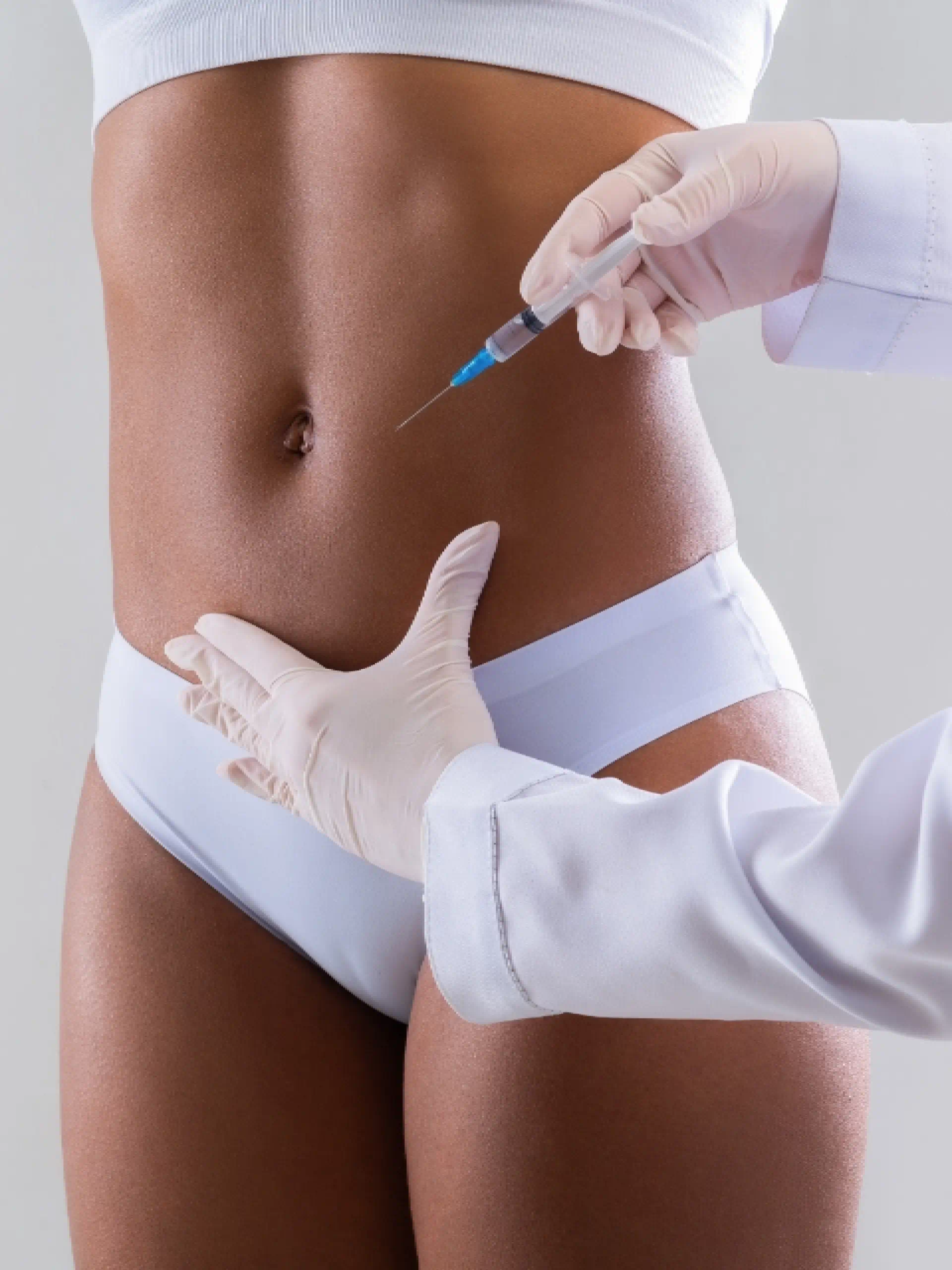 a person injecting a woman's belly