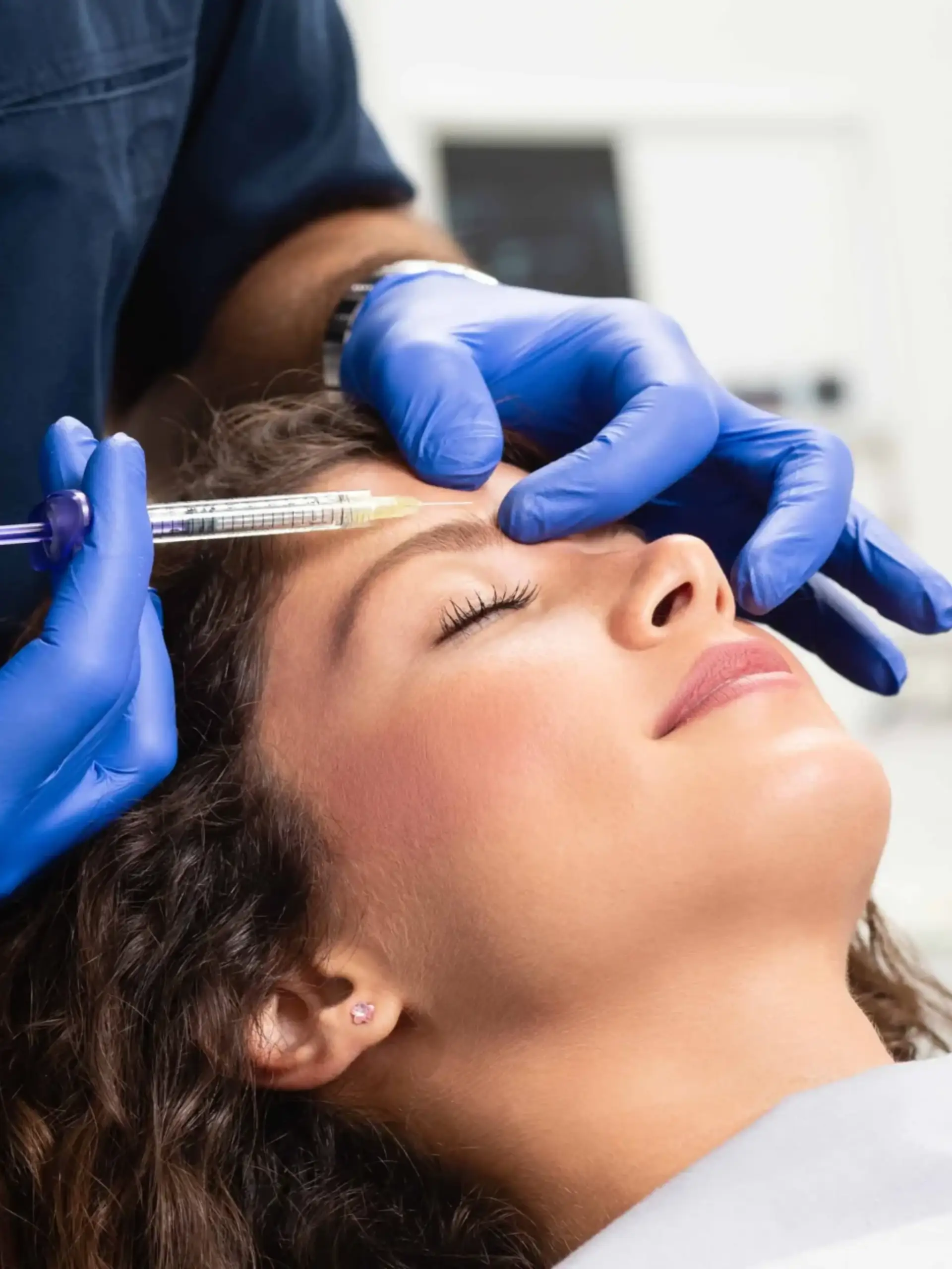 a person receiving a botox injection