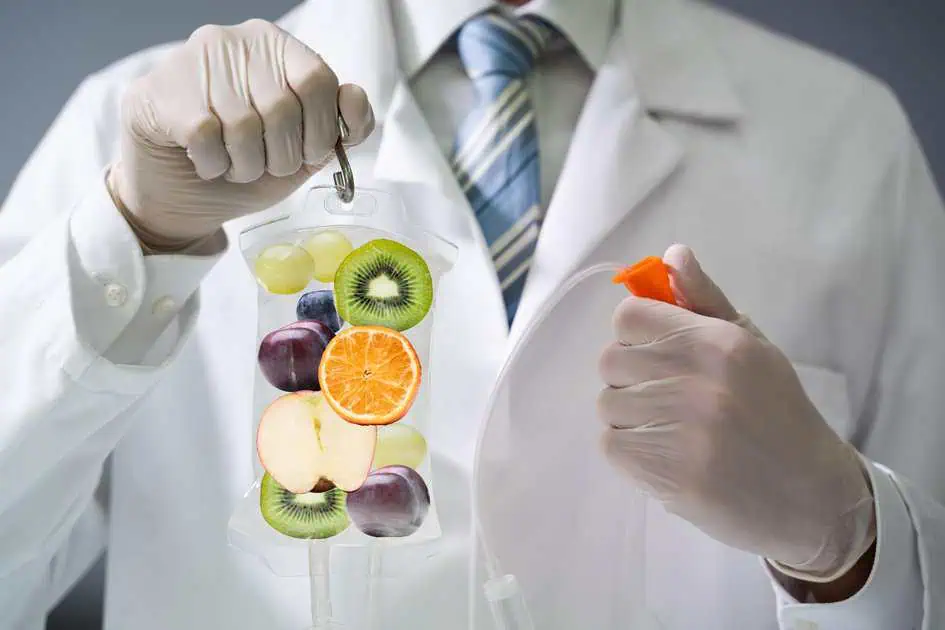 a person holding a bag of fruit, Vitamin IV Therapy in Virginia Beach, VA by Transformations Aesthetics & Wellness